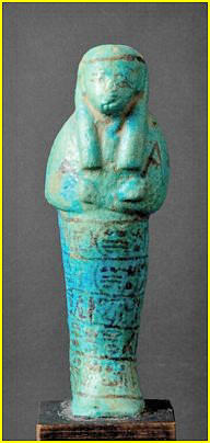 Shaouabti en faence de la divine adoratrice Henouttaoui. Terre siliceuse  glaure bleue et noire. H: 16 cm. Provenance: peut tre le Ramesseum. XXIe dynastie; 1085 - 950 avant Jsus CHRIST. 